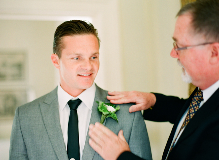 groom and father of the groom getting ready